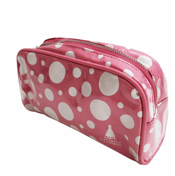 PVC toiletry pouch with pink polka dot design