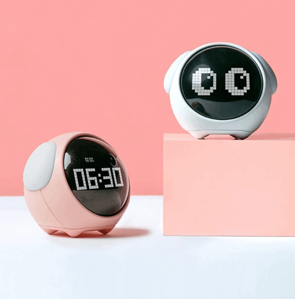 Pixel expression desk clock with digital display and animated face