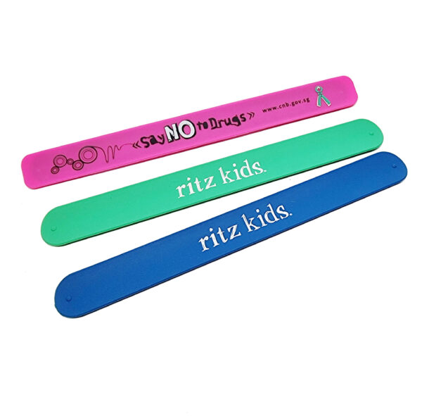 Assorted colourful slap wristbands for kids with custom printing.